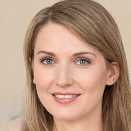 Joyful white young-adult female with long  brown hair and grey eyes