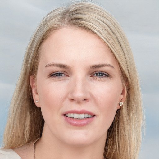 Joyful white young-adult female with long  brown hair and blue eyes