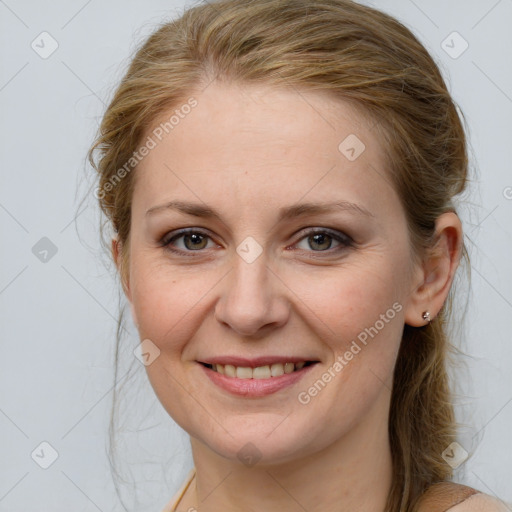 Joyful white adult female with medium  brown hair and grey eyes