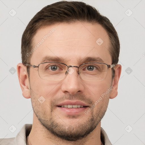 Joyful white adult male with short  brown hair and grey eyes