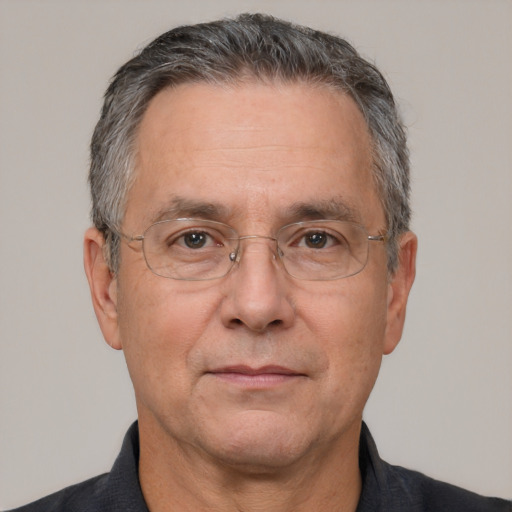 Neutral white middle-aged male with short  gray hair and brown eyes