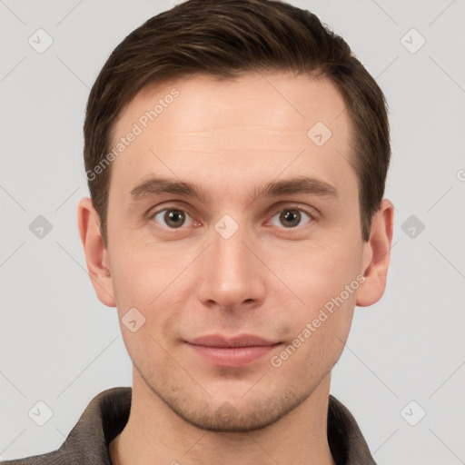 Joyful white young-adult male with short  brown hair and grey eyes