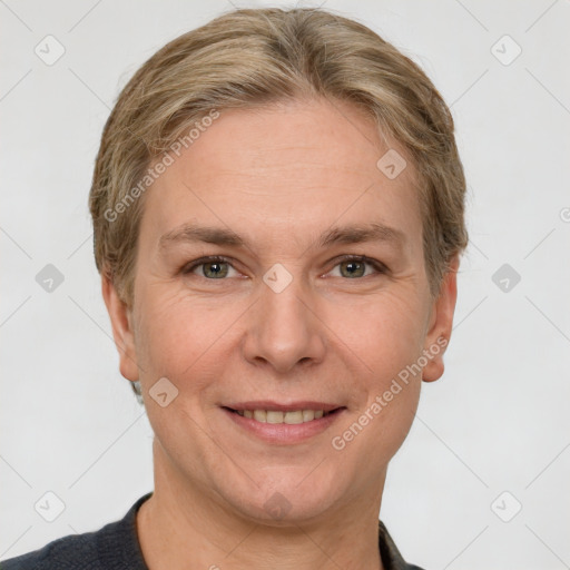 Joyful white adult female with short  brown hair and grey eyes