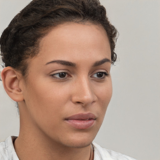 Neutral white young-adult female with short  brown hair and brown eyes