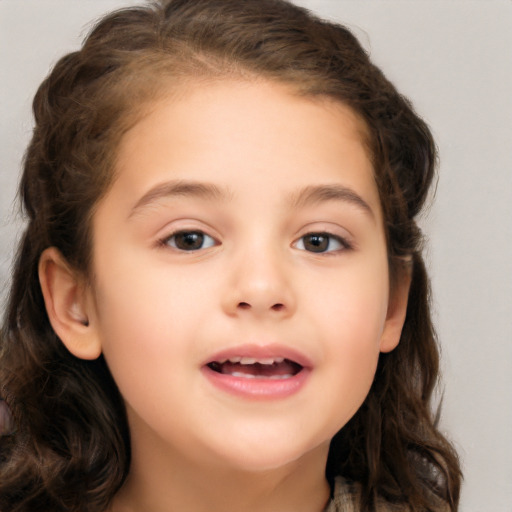 Joyful white child female with long  brown hair and brown eyes