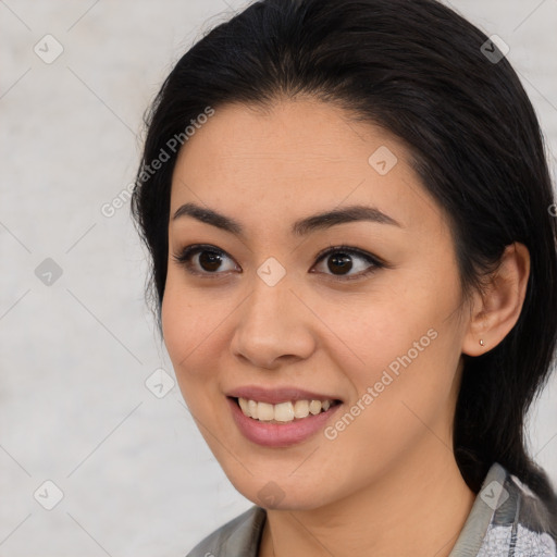 Joyful asian young-adult female with medium  brown hair and brown eyes