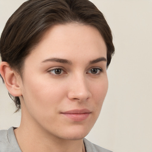 Neutral white young-adult female with short  brown hair and brown eyes