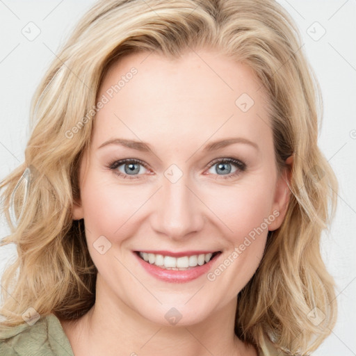 Joyful white young-adult female with medium  brown hair and blue eyes