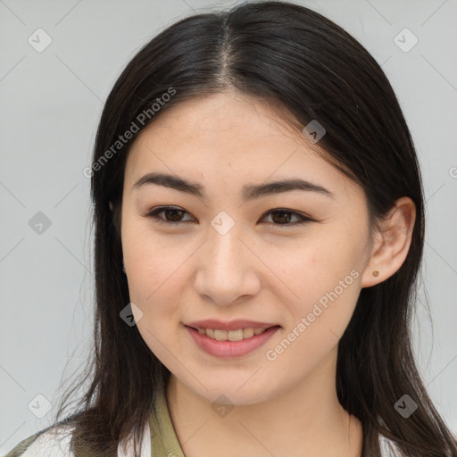 Joyful asian young-adult female with long  brown hair and brown eyes