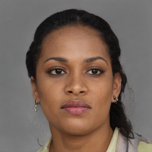 Neutral black young-adult female with medium  brown hair and brown eyes