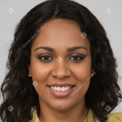 Joyful black young-adult female with long  brown hair and brown eyes