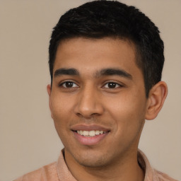 Joyful latino young-adult male with short  black hair and brown eyes