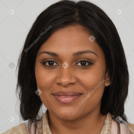 Joyful black adult female with medium  brown hair and brown eyes