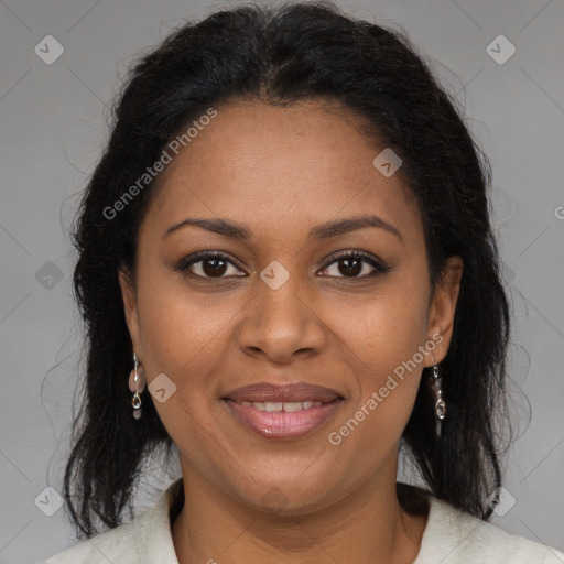 Joyful black adult female with medium  brown hair and brown eyes