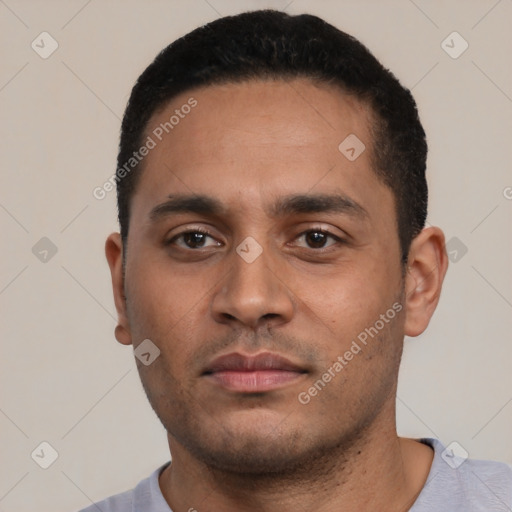 Neutral latino young-adult male with short  black hair and brown eyes