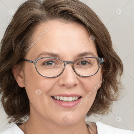 Joyful white adult female with medium  brown hair and blue eyes