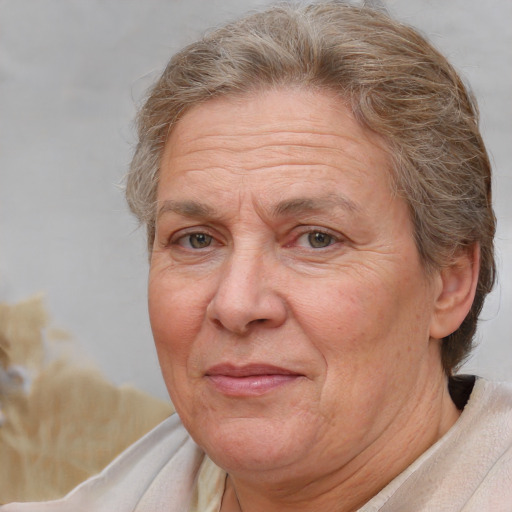 Joyful white middle-aged female with short  brown hair and brown eyes