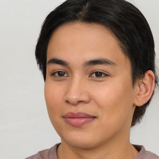 Joyful asian young-adult female with medium  brown hair and brown eyes