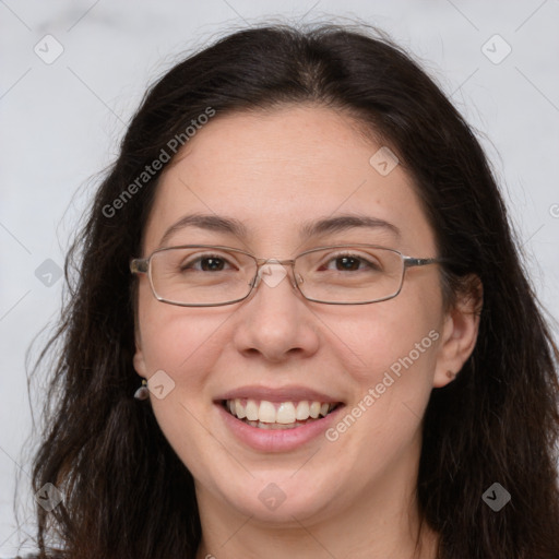 Joyful white adult female with long  brown hair and brown eyes