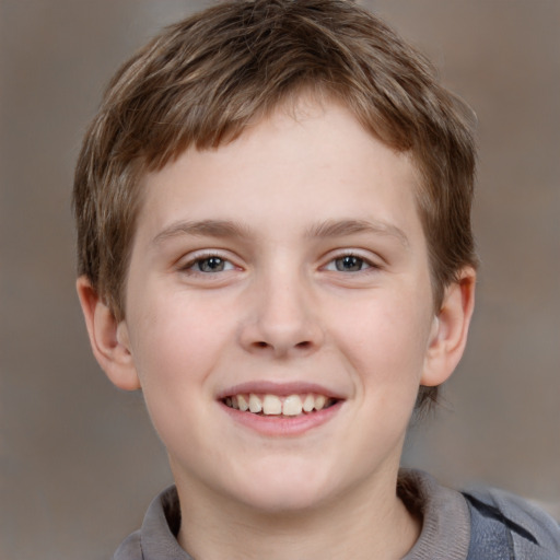 Joyful white child male with short  brown hair and grey eyes