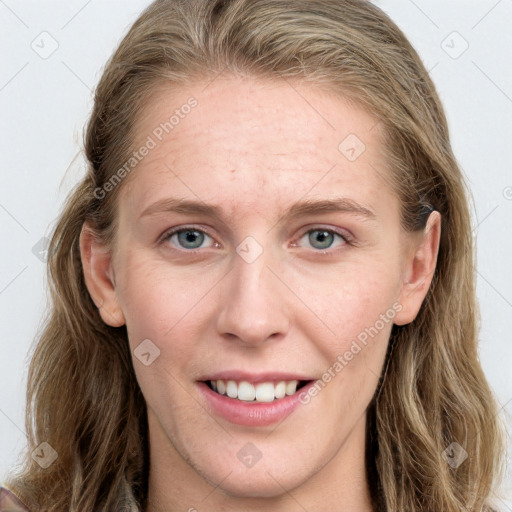 Joyful white young-adult female with long  brown hair and blue eyes