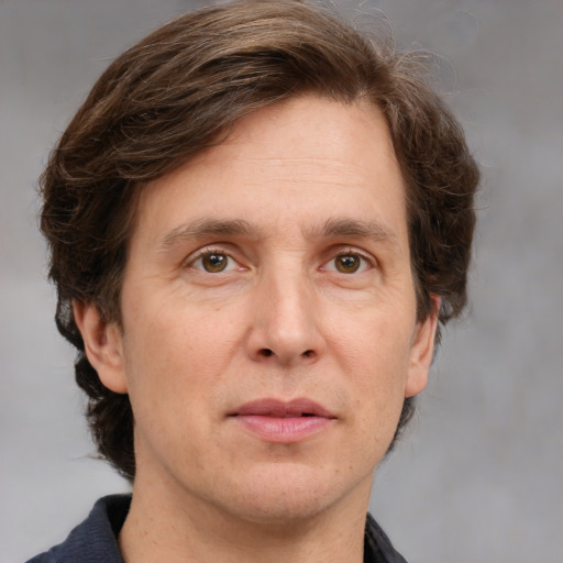 Joyful white adult male with medium  brown hair and grey eyes