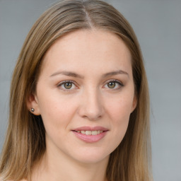 Joyful white young-adult female with long  brown hair and blue eyes