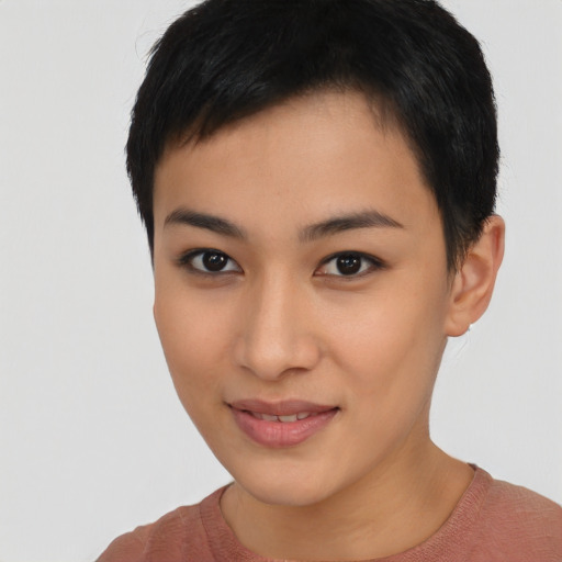 Joyful asian young-adult female with short  black hair and brown eyes