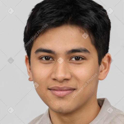 Joyful latino young-adult male with short  brown hair and brown eyes