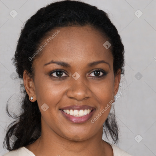 Joyful black young-adult female with medium  brown hair and brown eyes