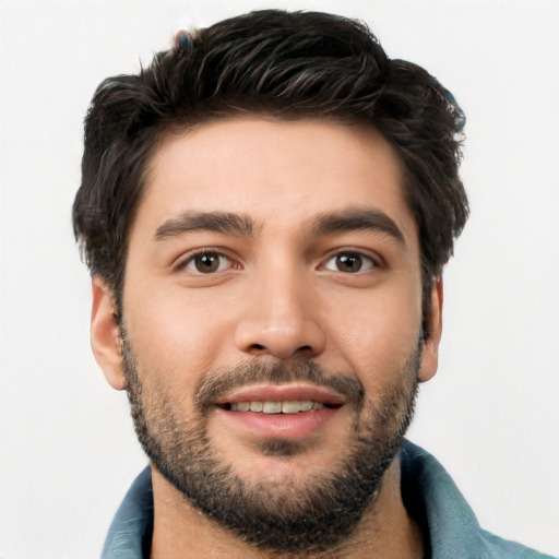 Joyful white young-adult male with short  black hair and brown eyes