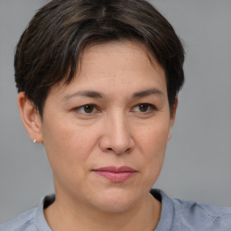 Joyful white adult female with short  brown hair and brown eyes