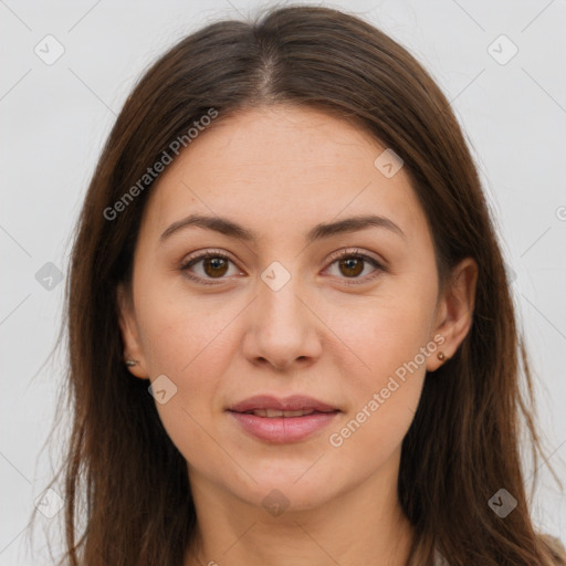 Joyful white young-adult female with long  brown hair and brown eyes