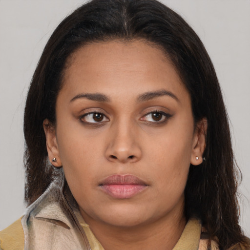 Neutral latino young-adult female with long  brown hair and brown eyes