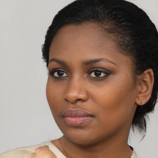 Neutral black young-adult female with short  brown hair and brown eyes