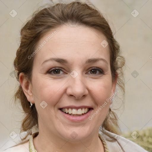 Joyful white adult female with medium  brown hair and grey eyes