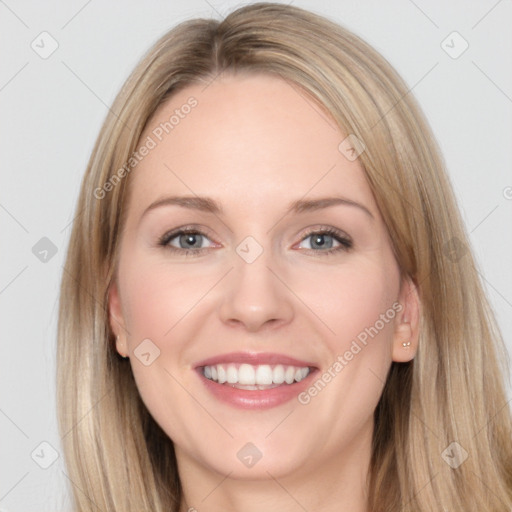 Joyful white young-adult female with long  brown hair and blue eyes