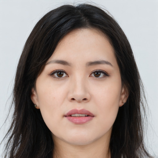 Joyful asian young-adult female with long  brown hair and brown eyes