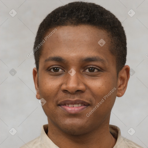 Joyful latino young-adult male with short  brown hair and brown eyes