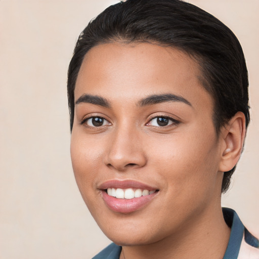 Joyful white young-adult female with medium  brown hair and brown eyes