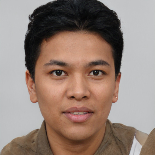 Joyful asian young-adult male with short  brown hair and brown eyes