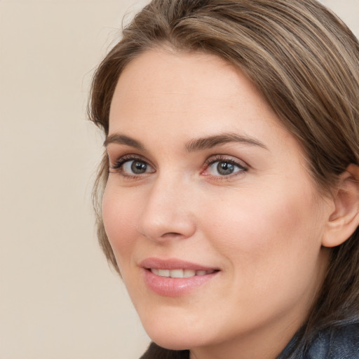 Joyful white young-adult female with medium  brown hair and blue eyes