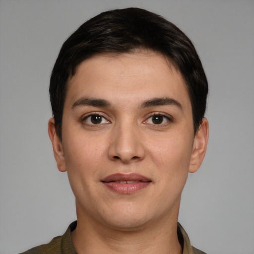 Joyful white young-adult male with short  black hair and brown eyes