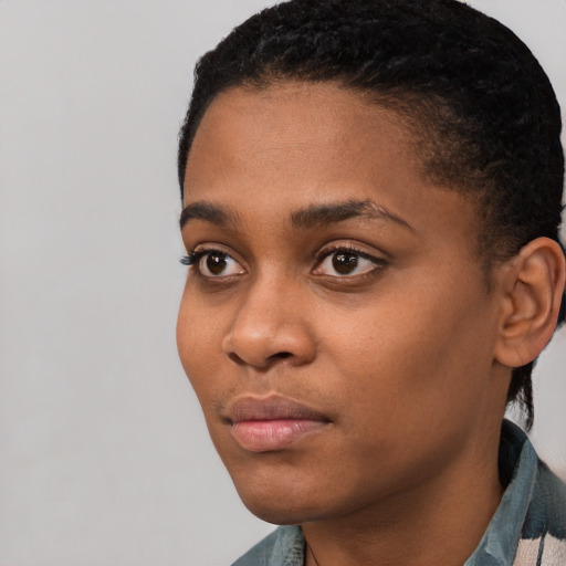 Neutral black young-adult female with short  black hair and brown eyes