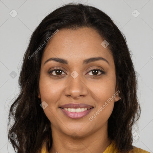 Joyful latino young-adult female with long  brown hair and brown eyes