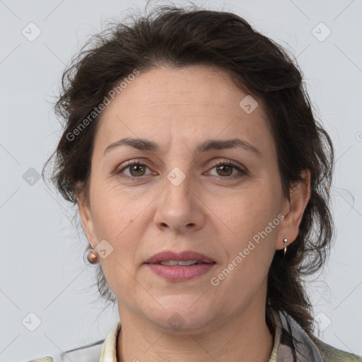 Joyful white adult female with medium  brown hair and grey eyes