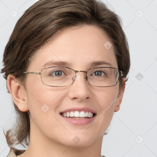 Joyful white adult female with medium  brown hair and grey eyes