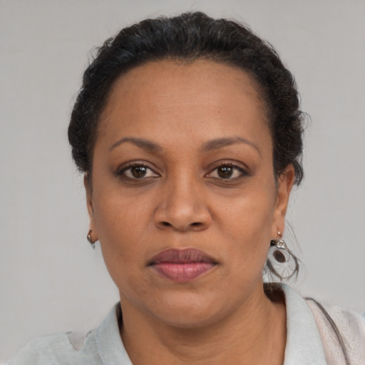 Neutral black adult female with short  brown hair and brown eyes
