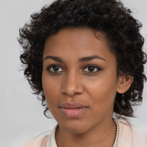 Neutral black young-adult female with long  brown hair and brown eyes