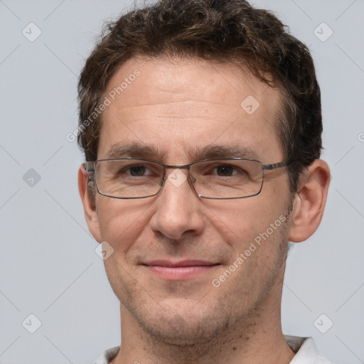 Joyful white adult male with short  brown hair and grey eyes